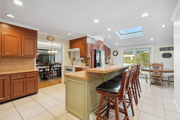 Chandelier, Dining room, Interior, Kitchen, Recessed Lighting, Stainless Steel Appliances, Wood Texture Flooring