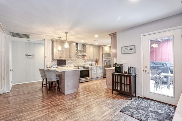 Dining room, Interior, Kitchen, Pendant Lights, Recessed Lighting, Stainless Steel Appliances, Wood Texture Flooring