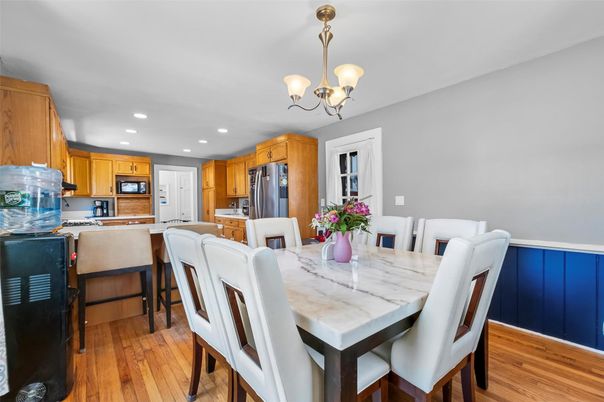 Chandelier, Dining room, Interior, Kitchen, Recessed Lighting, Stainless Steel Appliances, Wood Texture Flooring