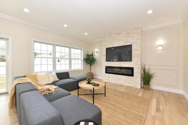 Fireplace, Interior, Living room, Recessed Lighting, Stone Walls, Wood Texture Flooring