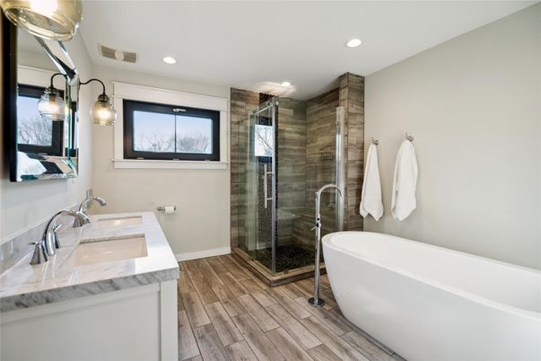 Bathroom, Dual Sink Vanities, Free Standing Baths, Glass Shower, Interior, Recessed Lighting, Wood Texture Flooring