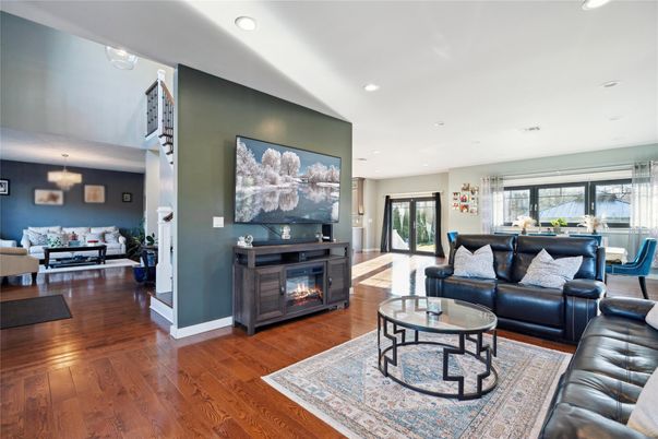 Dining room, Fireplace, Interior, Living room, Recessed Lighting, Wood Texture Flooring