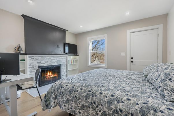 Bedroom, Fireplace, Interior, Recessed Lighting, Wood Texture Flooring