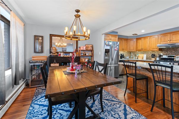 Chandelier, Dining room, Interior, Kitchen, Pendant Lights, Recessed Lighting, Stainless Steel Appliances, Wood Texture Flooring