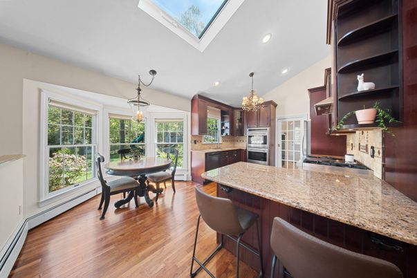 Chandelier, Dining room, Interior, Kitchen, Pendant Lights, Recessed Lighting, Stainless Steel Appliances, Wood Texture Flooring