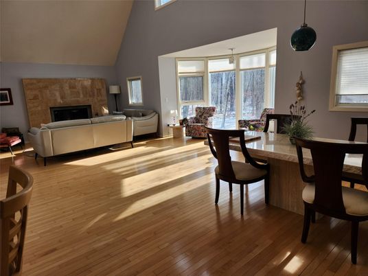 Dining room, Fireplace, Interior, Living room, Pendant Lights, Stone Walls, Wood Texture Flooring