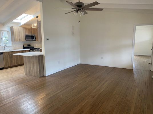 Empty room, Interior, Kitchen, Stainless Steel Appliances, Wood Texture Flooring