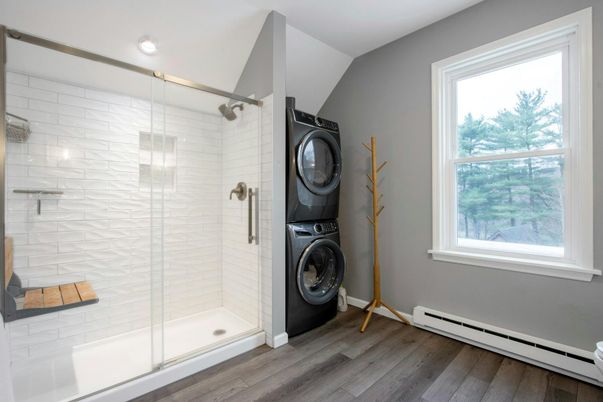Bathroom, Glass Shower, Interior, Recessed Lighting, Utility Closets, Washer, Wood Texture Flooring