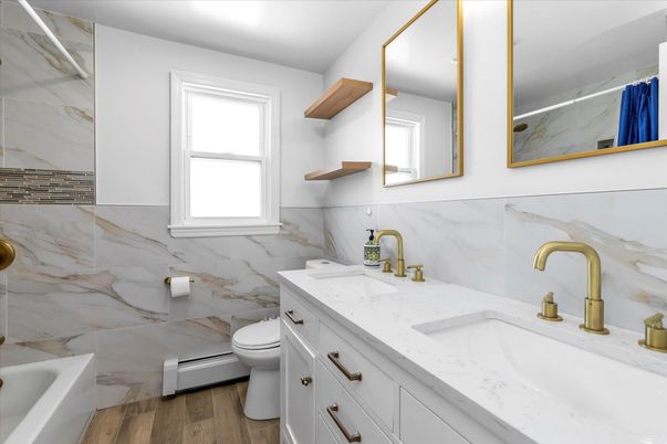 Bathroom, Dual Sink Vanities, Interior, Marble Walls, Wood Texture Flooring