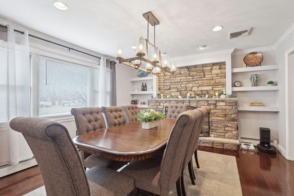 Dining room, Fireplace, Interior, Pendant Lights, Recessed Lighting, Stone Walls, Wood Texture Flooring