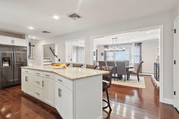 Chandelier, Dining room, Interior, Kitchen, Pendant Lights, Recessed Lighting, Stainless Steel Appliances, Wood Texture Flooring