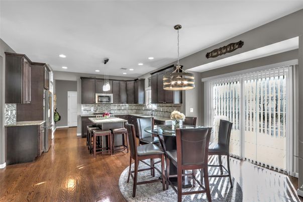 Dining room, Interior, Kitchen, Pendant Lights, Recessed Lighting, Stainless Steel Appliances, Wood Texture Flooring