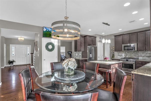 Chandelier, Dining room, Interior, Kitchen, Pendant Lights, Recessed Lighting, Stainless Steel Appliances, Wood Texture Flooring