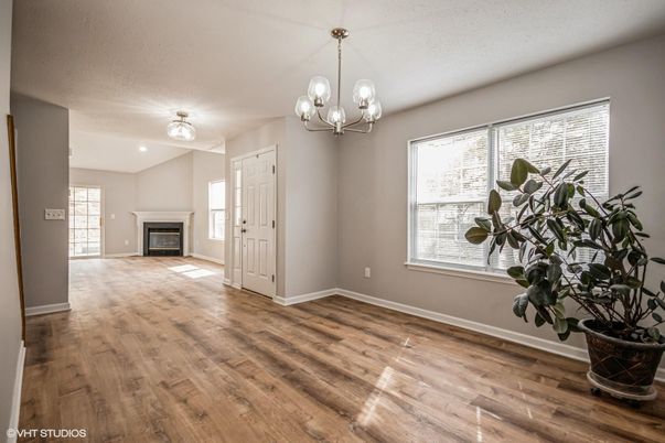 Chandelier, Empty room, Fireplace, Interior, Recessed Lighting, Wood Texture Flooring