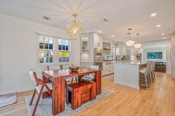 Dining room, Interior, Kitchen, Pendant Lights, Recessed Lighting, Stainless Steel Appliances, Wood Texture Flooring