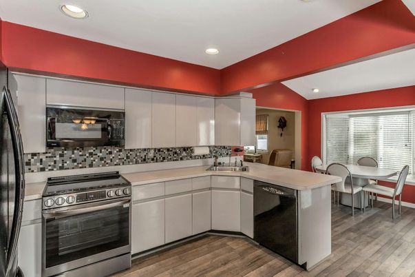Dining room, Interior, Kitchen, Recessed Lighting, Stainless Steel Appliances, Wood Texture Flooring