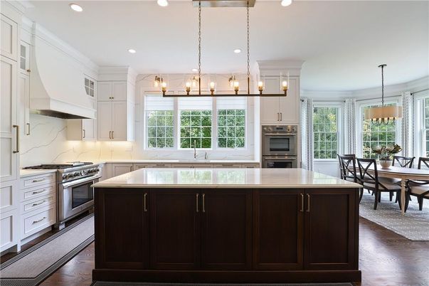 Chandelier, Dining room, Interior, Kitchen, Pendant Lights, Recessed Lighting, Stainless Steel Appliances, Wood Texture Flooring
