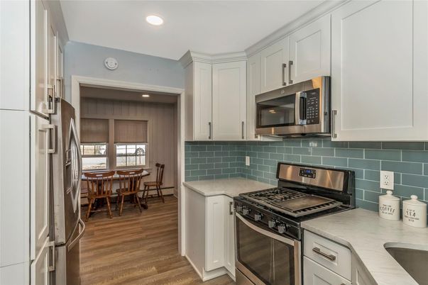 Dining room, Interior, Kitchen, Recessed Lighting, Stainless Steel Appliances, Wood Texture Flooring