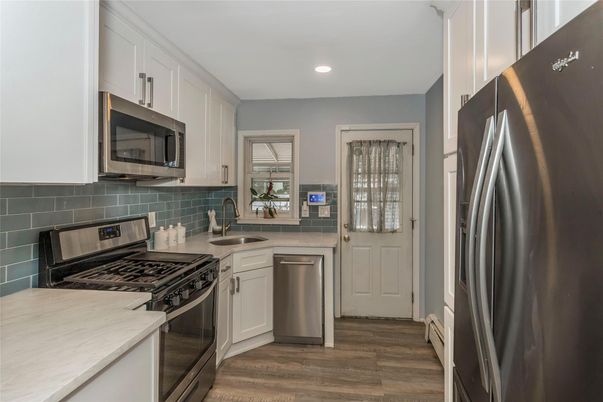 Interior, Kitchen, Recessed Lighting, Stainless Steel Appliances, Wood Texture Flooring