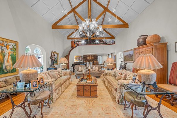 Chandelier, Fireplace, Interior, Living room, Piano, Recessed Lighting, Wooden Beams, Wood Texture Flooring