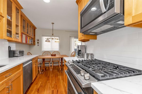 Dining room, Interior, Kitchen, Pendant Lights, Recessed Lighting, Stainless Steel Appliances, Wood Texture Flooring