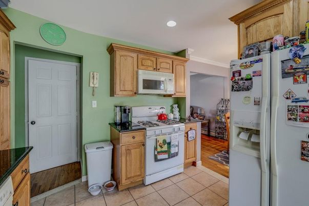 Interior, Kitchen, Recessed Lighting, Washer, Wood Texture Flooring