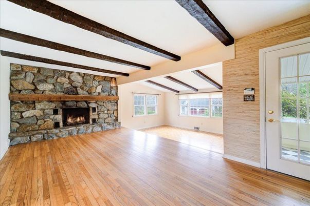 Empty room, Fireplace, Interior, Stone Walls, Wooden Beams, Wood Texture Flooring