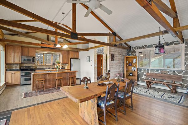Dining room, Interior, Kitchen, Pendant Lights, Stainless Steel Appliances, Stone Walls, Wooden Beams, Wood Texture Flooring