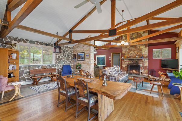 Dining room, Fireplace, Interior, Living room, Stone Walls, Wooden Beams, Wood Texture Flooring