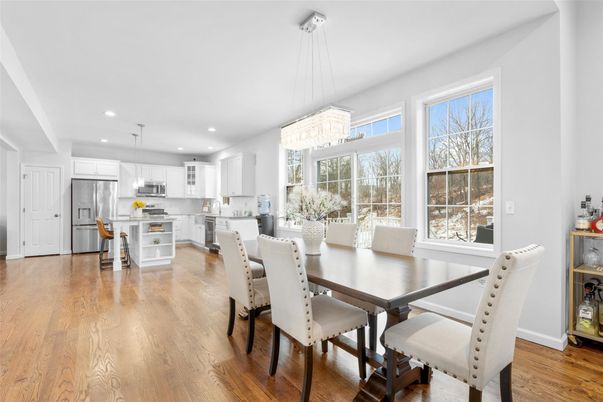 Chandelier, Dining room, Interior, Kitchen, Pendant Lights, Recessed Lighting, Stainless Steel Appliances, Wood Texture Flooring