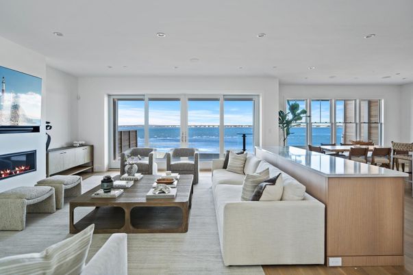 Dining room, Fireplace, Interior, Living room, Recessed Lighting, Water, Wood Texture Flooring