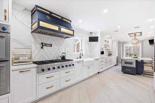 Interior, Kitchen, Marble Walls, Pendant Lights, Recessed Lighting, Stainless Steel Appliances, Wood Texture Flooring