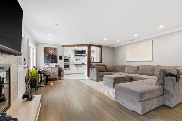 Fireplace, Interior, Living room, Recessed Lighting, Stone Walls, Wood Texture Flooring