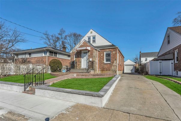 Exterior, Facade, Brick Facade, Cape Cod
