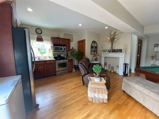Fireplace, Interior, Kitchen, Living room, Recessed Lighting, Stainless Steel Appliances, Wood Texture Flooring