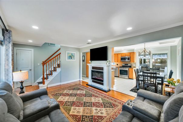 Dining room, Fireplace, Interior, Kitchen, Living room, Pendant Lights, Recessed Lighting, Stainless Steel Appliances, Wood Texture Flooring