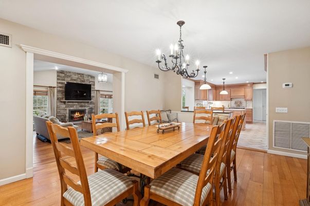 Chandelier, Dining room, Fireplace, Interior, Kitchen, Living room, Pendant Lights, Recessed Lighting, Stone Walls, Wood Texture Flooring
