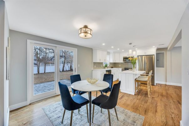 Dining room, Interior, Kitchen, Pendant Lights, Recessed Lighting, Stainless Steel Appliances, Wood Texture Flooring