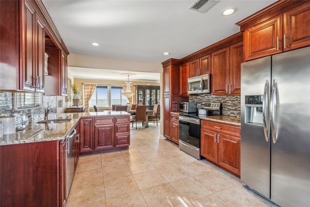 Chandelier, Dining room, Interior, Kitchen, Pendant Lights, Recessed Lighting, Stainless Steel Appliances