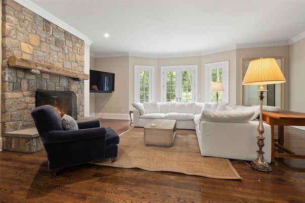 Fireplace, Interior, Living room, Recessed Lighting, Stone Walls, Wood Texture Flooring