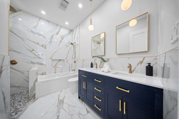 Bathroom, Dual Sink Vanities, Interior, Marble, Marble Walls, Pendant Lights, Recessed Lighting