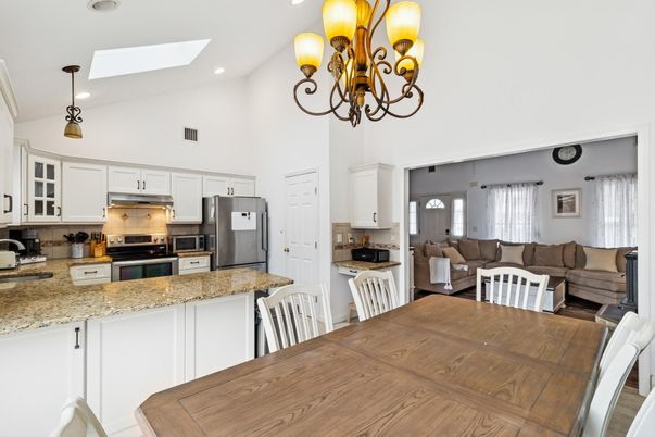 Chandelier, Dining room, Interior, Kitchen, Living room, Pendant Lights, Recessed Lighting, Stainless Steel Appliances