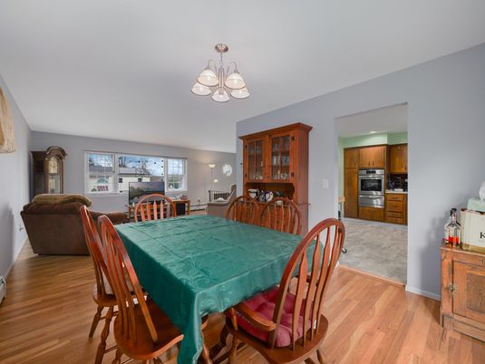 Chandelier, Dining room, Interior, Kitchen, Stainless Steel Appliances, Wood Texture Flooring