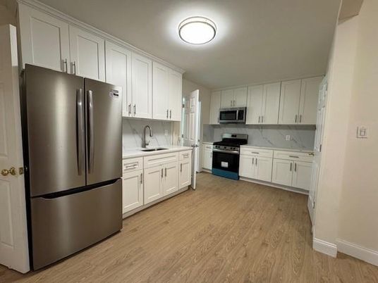 Interior, Kitchen, Marble Walls, Stainless Steel Appliances, Wood Texture Flooring