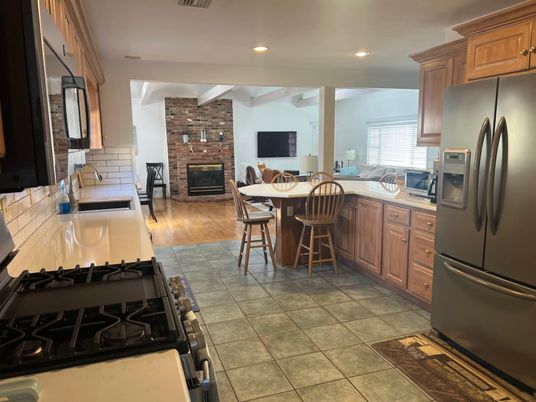 Dining room, Fireplace, Interior, Kitchen, Recessed Lighting, Stone Walls, Wood Texture Flooring