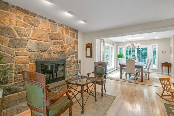 Chandelier, Dining room, Fireplace, Interior, Recessed Lighting, Stone Walls, Wood Texture Flooring