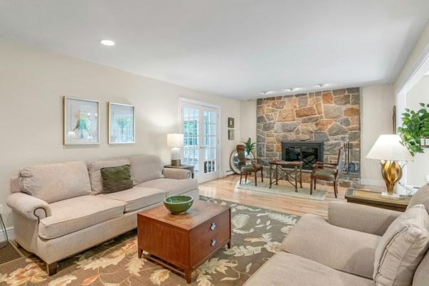 Dining room, Fireplace, Interior, Living room, Recessed Lighting, Stone Walls, Wood Texture Flooring