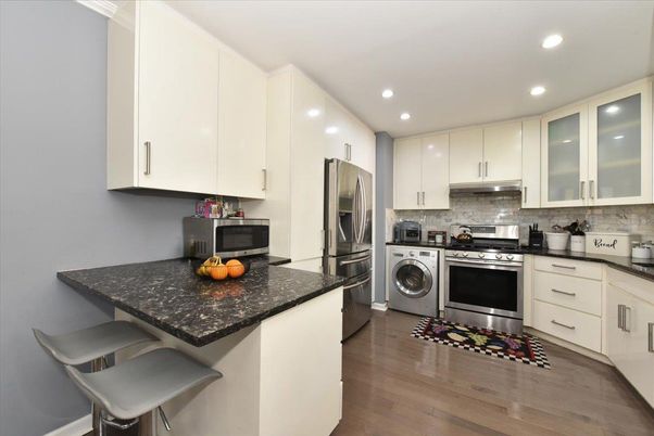 Interior, Kitchen, Recessed Lighting, Stainless Steel Appliances, Washer, Wood Texture Flooring