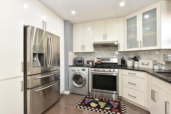 Interior, Kitchen, Recessed Lighting, Stainless Steel Appliances, Washer, Wood Texture Flooring