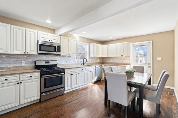 Dining room, Interior, Kitchen, Recessed Lighting, Stainless Steel Appliances, Wood Texture Flooring